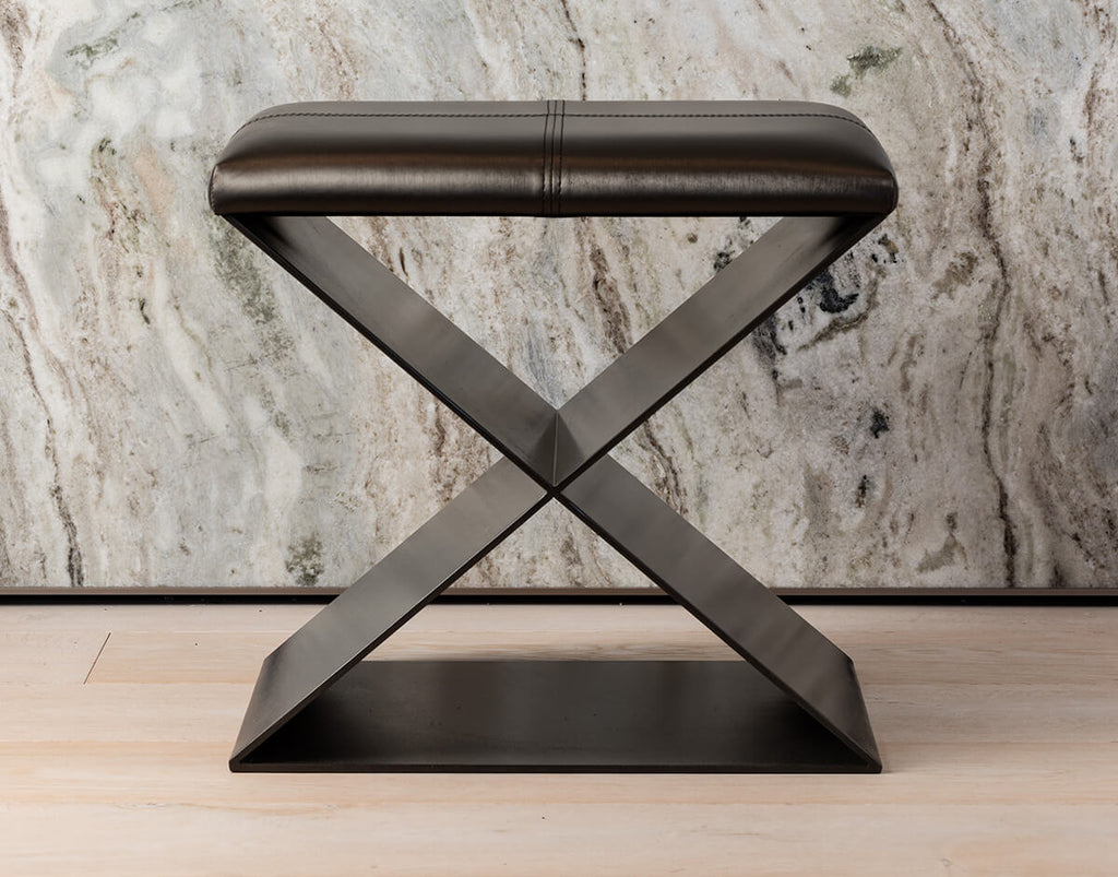 Dark brown leather upholstered Mons Table stool with metal resin coated crisscross base