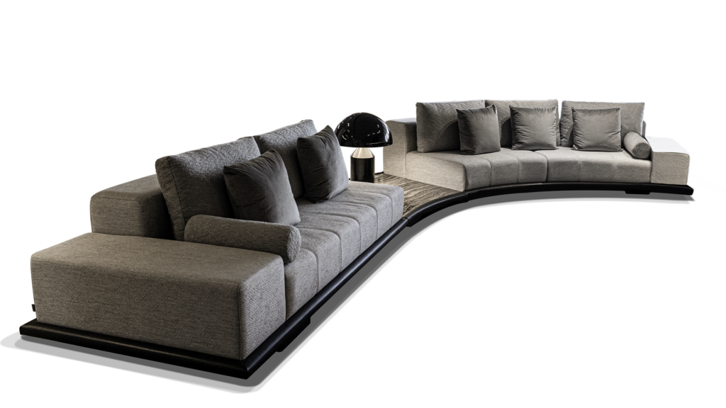 Greenwich Sofa curved modular sofa with light grey upholstery and dark accent pillows