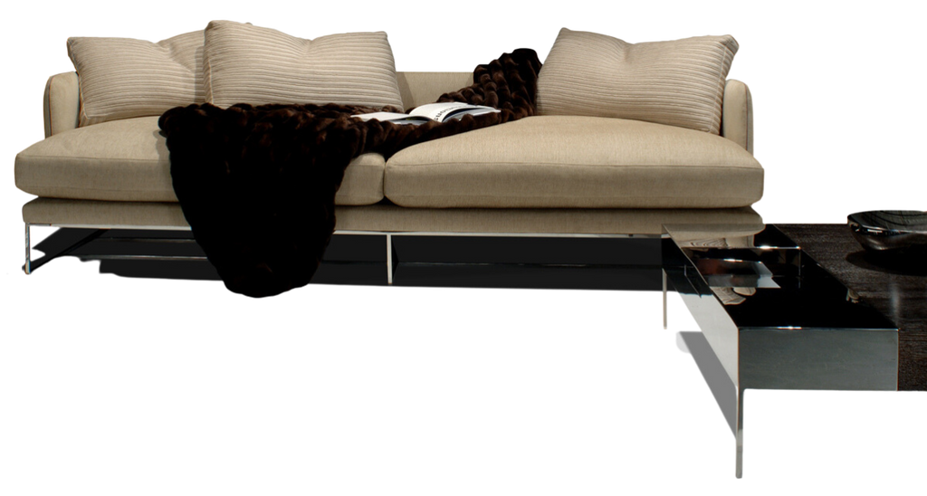 Paris Sofa featuring a light beige color, throw pillows, and a dark blanket for cozy comfort