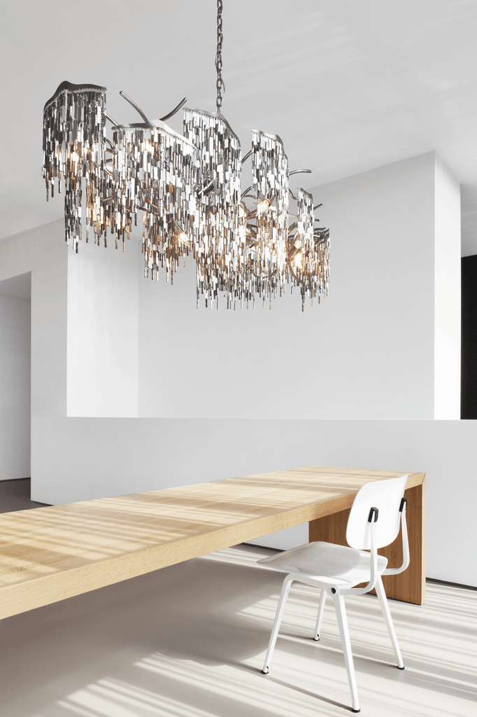 Arthur Chandelier Oval featuring a modern rectangular design with metallic fringe elements