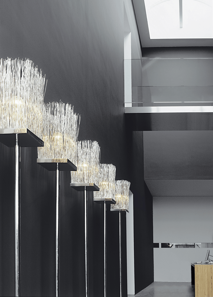 Modern Broom Floor Lamp with illuminated spiky white fronded tops for stylish lighting