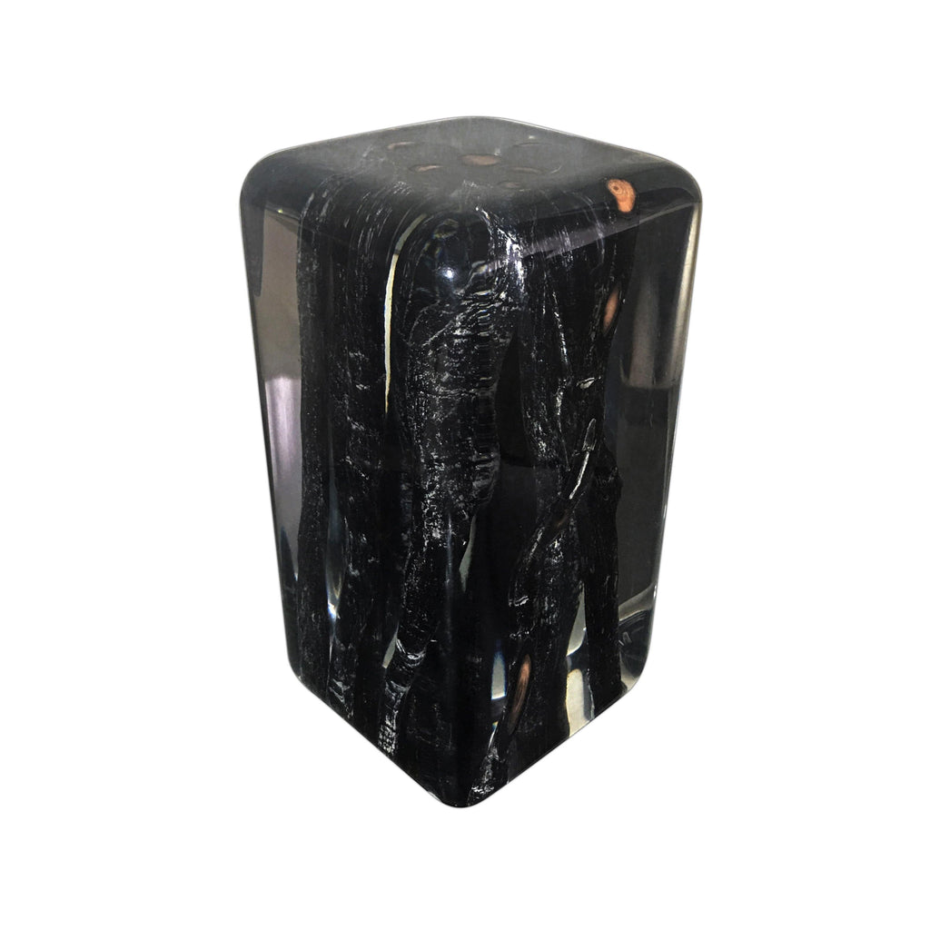 Polished black resin burnt branches cube with textured internal patterns and rounded top