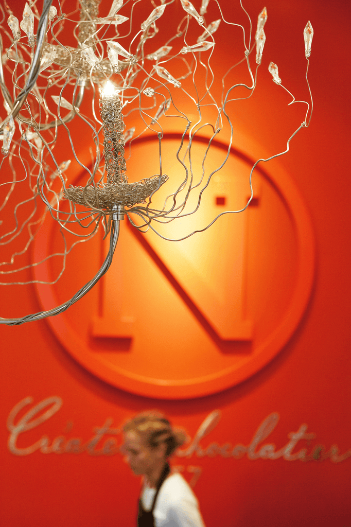 Ornate wire and crystal chandelier with glowing candle-like bulb for Candles And Spirits Chandelier Round