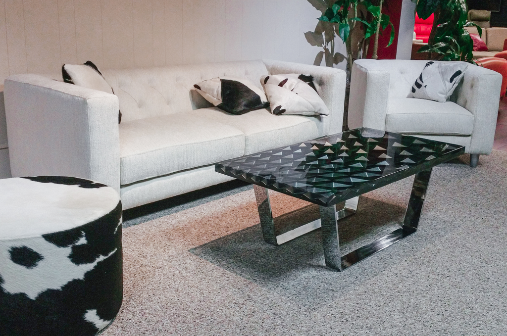 Modern living room with Phebus Diamond Black Coffee Table, black coffee table, and white sofa