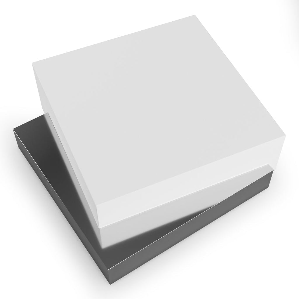 Two-piece gift box with white lid and dark base on Docimium Lacquered Coffee Table