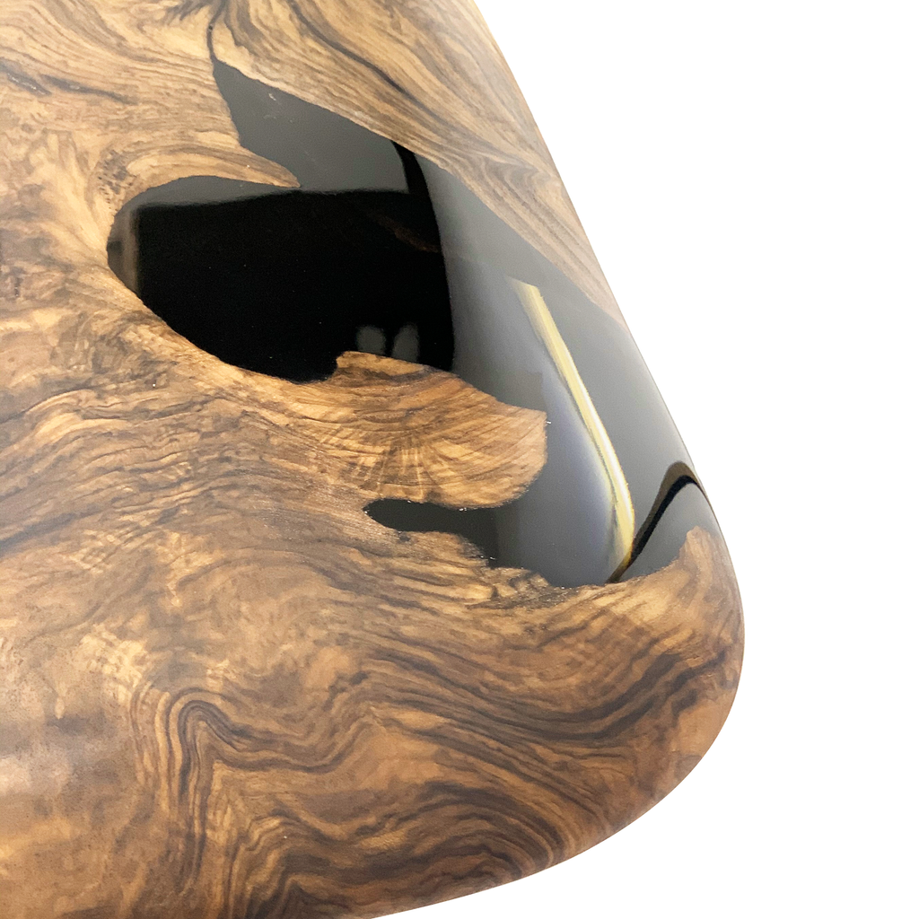 Evohe Black River Walnut Dining Table with dark resin inlay on walnut wood surface