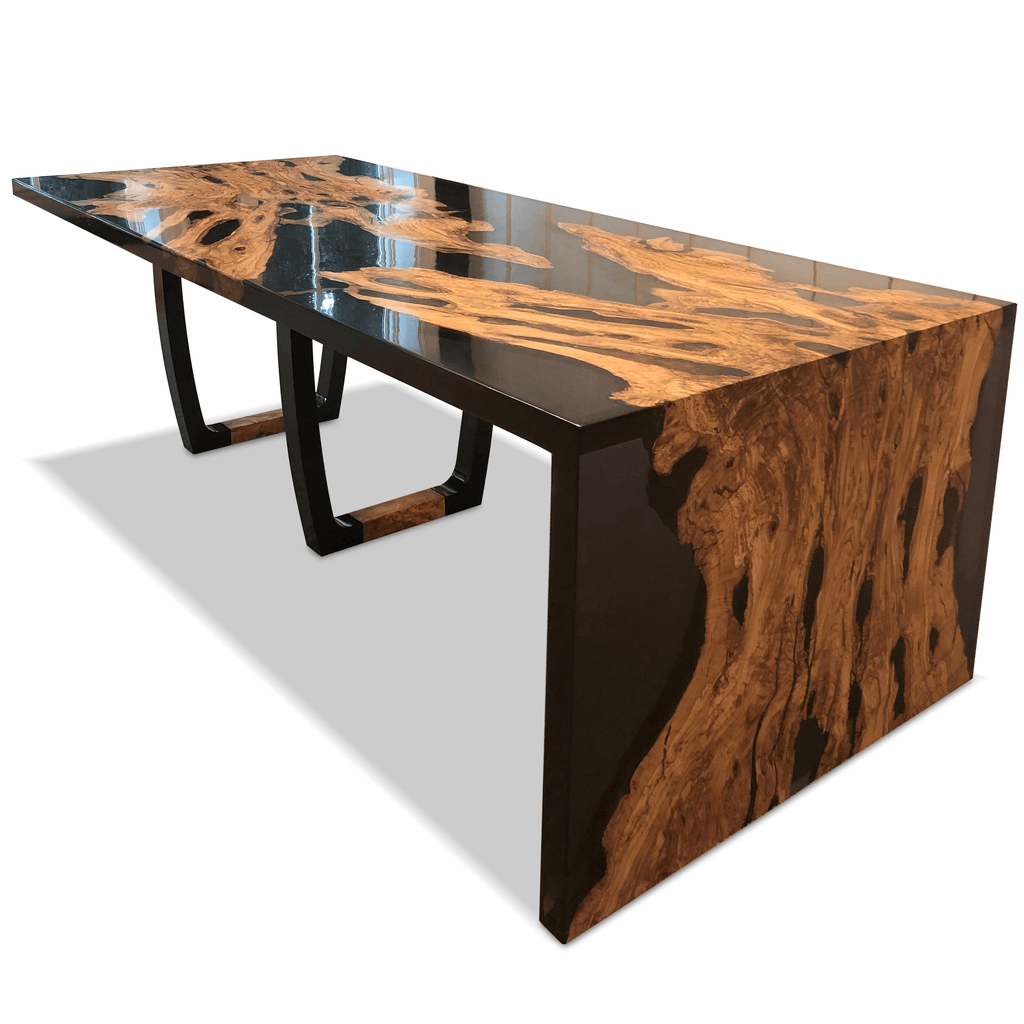 Black Staphyle olive wood dining table with clear resin top and curved black base