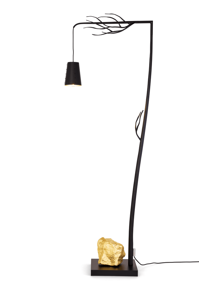 Flintstone Floor Lamp with branch-like black design and gold-colored rock base