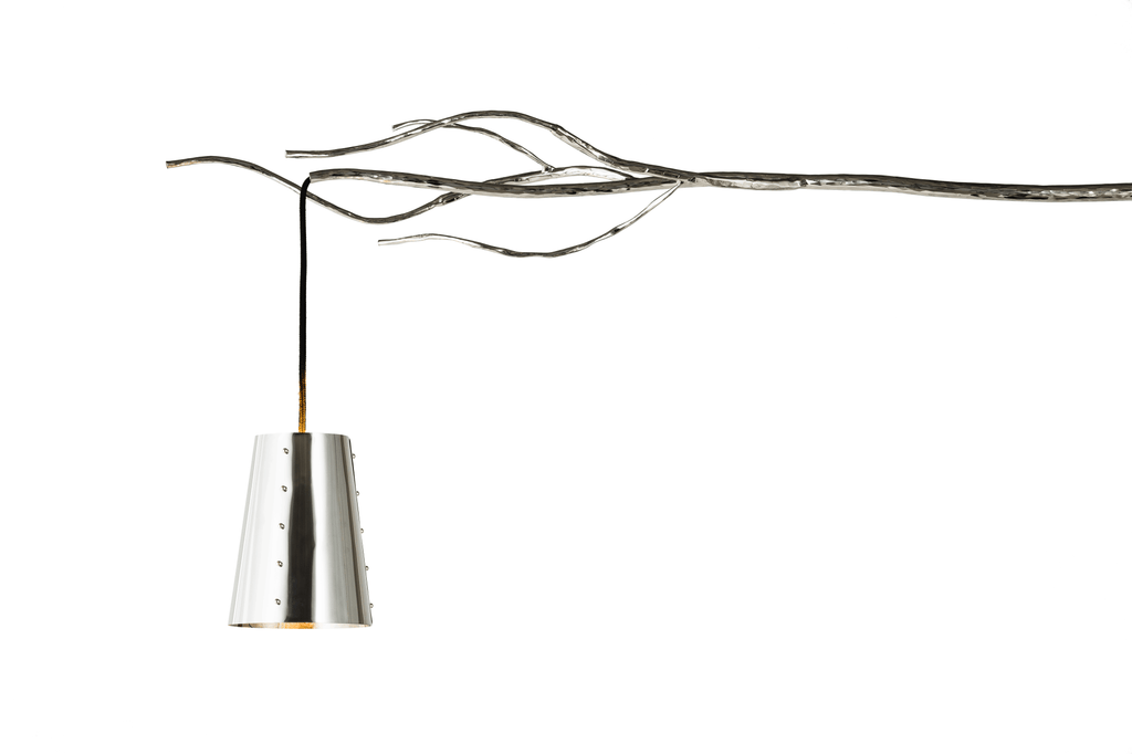 Modern silver-colored Flintstone Floor Lamp with conical shade hanging from decorative branch