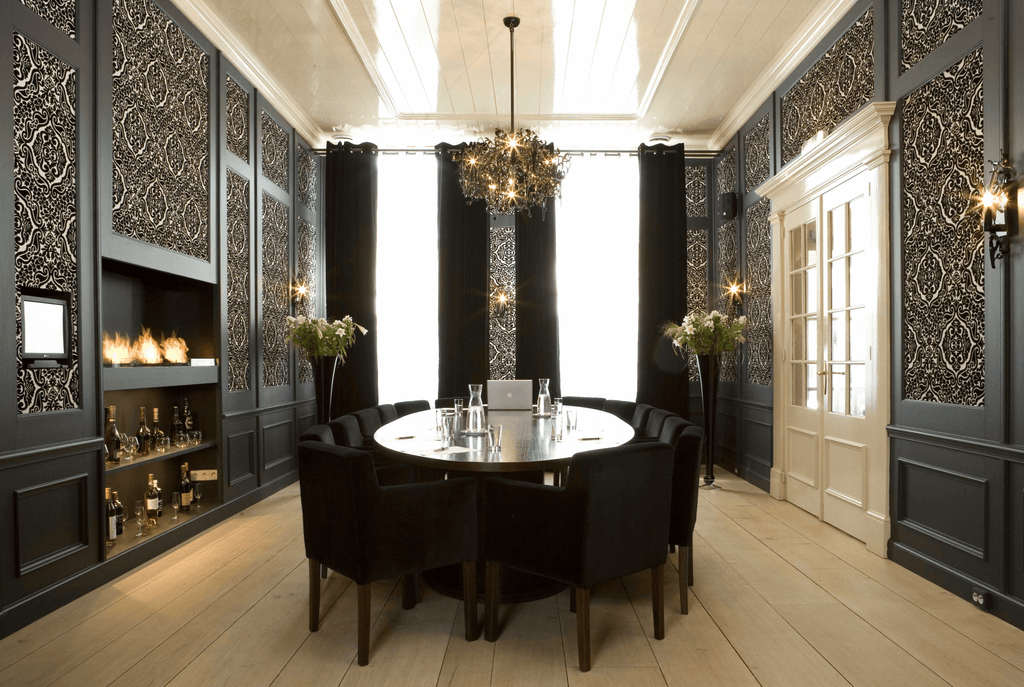 Formal meeting room with Flower Power Chandelier Oval and dark color scheme ambiance