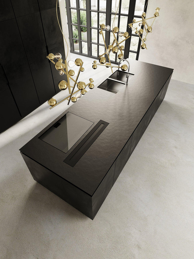 Black kitchen island with sink and cooktop, paired with Galaxy Chandelier Round lighting