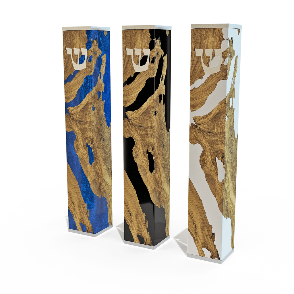 Modern mezuzah with three tall rectangular wooden and resin cases in blue black and white