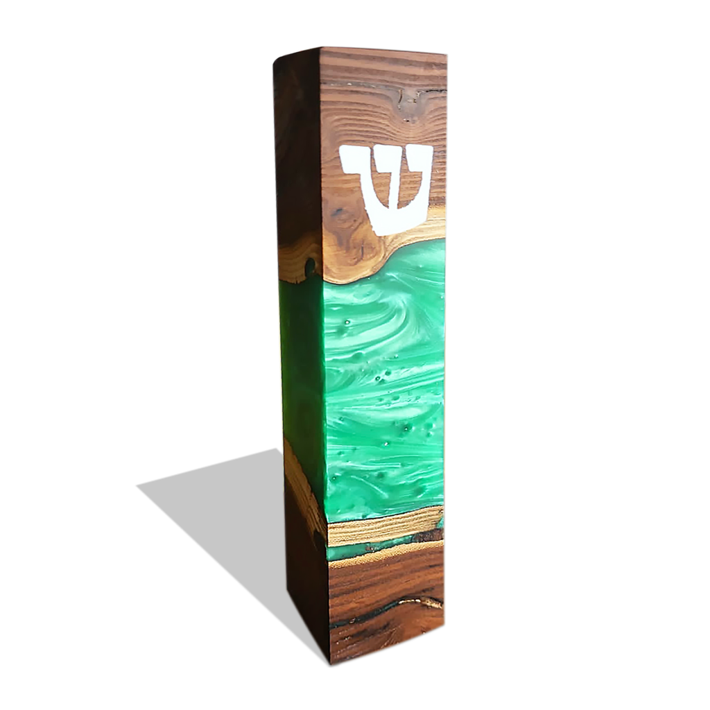 Modern mezuzah case in dark wood and green resin with white Hebrew Shin symbol