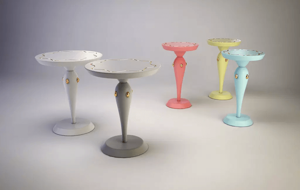 Colorful bird baths with decorative bases displayed on Napoleon Accent Table for stylish decor