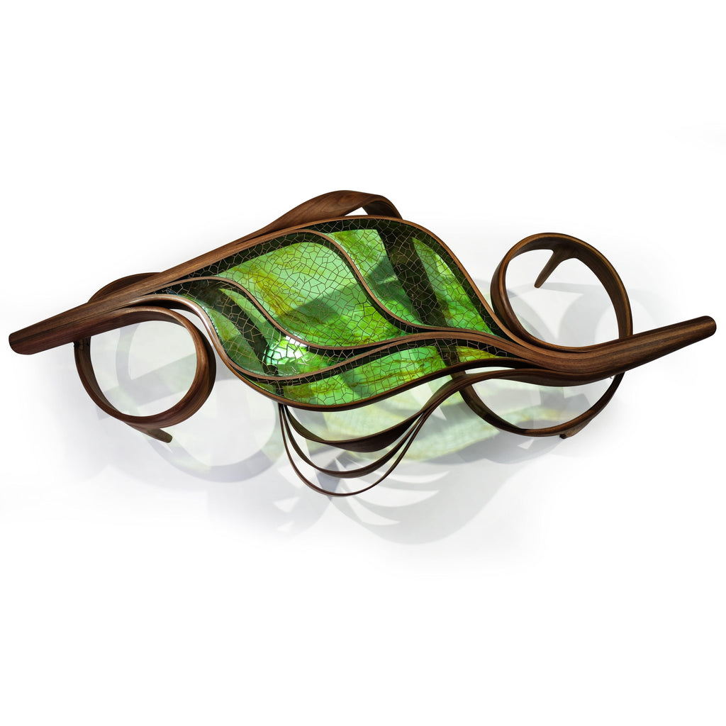 Abstract wall sculpture resembling a stylized leaf for Natural Ivy Coffee Table decor