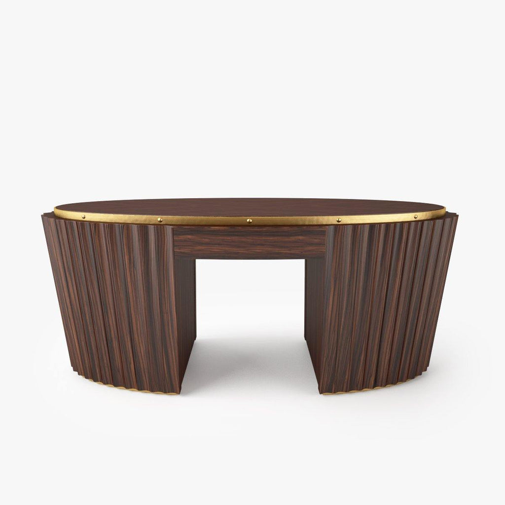 Dark wood oval cocktail table with brass rim and textured fluted sides
